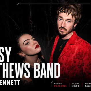 A concert poster of the Krissy Matthews Band featuring Kim Jennett. It shows the two musicians in stylish clothing against a dark background. | © Rockhouse Salzburg