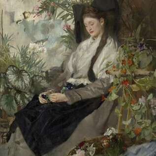 A girl is sitting in a room full of plants and flowers. She has long hair and is wearing elegant clothing. | © DomQuartier