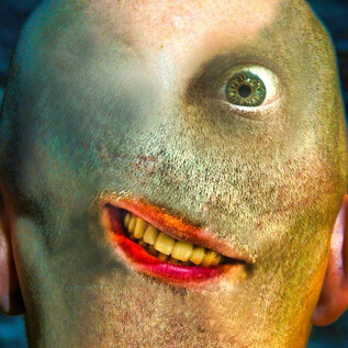 A surreal head with an unusual facial expression and a mix of human and animal features. The eyes and mouth are striking and create a bizarre mood. | © Benjamin Blaikner